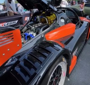 Radical race car at Supercar Saturdays Florida, drawing selfies, engagement, and conversations about Montana plates.