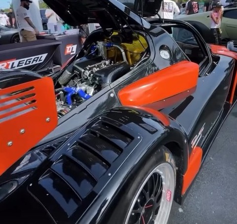 Radical race car at Supercar Saturdays Florida, drawing selfies, engagement, and conversations about Montana plates.