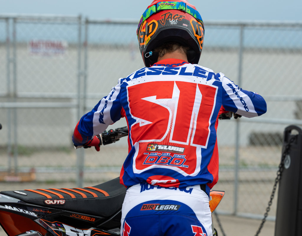 A back-view shot of Jace Kessler, wearing the #511 Dirt Legal DBDRacing jersey.