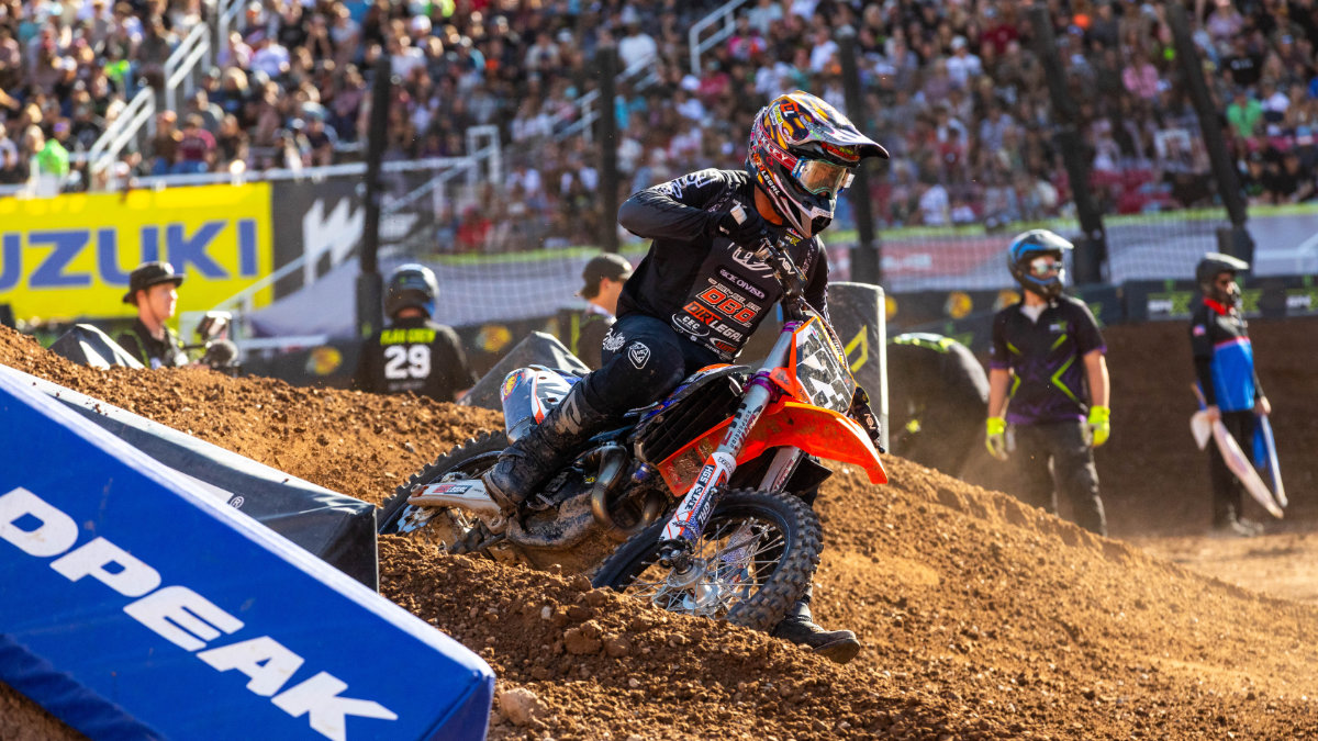 Anthony Rodriguez on the Dirt Legal DBDRacing KTM charging through a rutted berm during the 2026 Salt Lake City Supercross