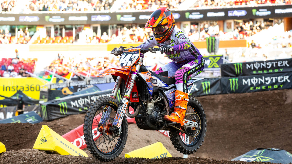 Jaxen Driskell aboard the Dirt Legal KTM number 143 powering over a jump during the 2026 Salt Lake City Supercross East/West Showdown