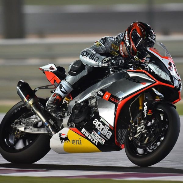 Professional motorcycle racer leaning into a turn on a sport bike during Biketoberfest in Daytona Beach, representing DirtLegal.